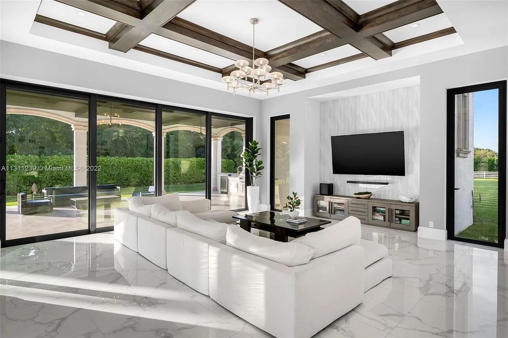 5875 Stone Creek Way, Fort Lauderdale, Florida, built by acclaimed builder Rick Bell, sits on 5 acres and boasts over 20,000 square feet of space. This incredible and one-of-a-kind custom compound's grand estate, including private gates, features volume ceilings, a resort-style pool, and top-of-the-line appliances.