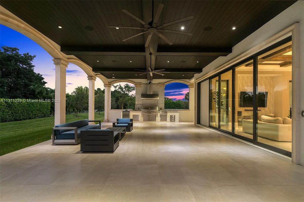 5875 Stone Creek Way, Fort Lauderdale, Florida, built by acclaimed builder Rick Bell, sits on 5 acres and boasts over 20,000 square feet of space. This incredible and one-of-a-kind custom compound's grand estate, including private gates, features volume ceilings, a resort-style pool, and top-of-the-line appliances.