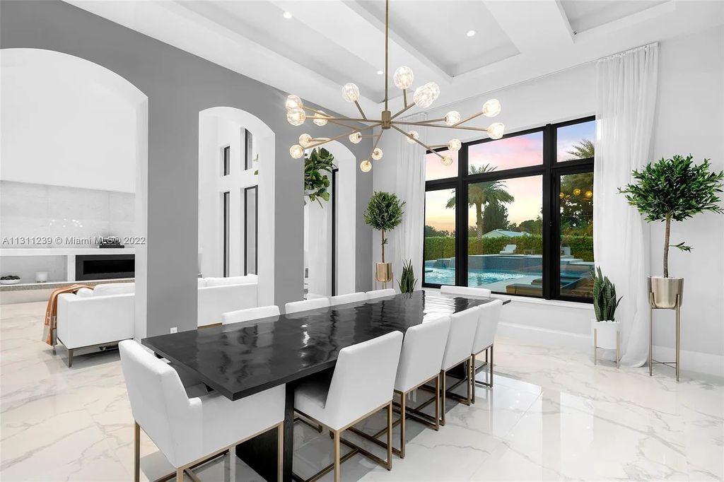 5875 Stone Creek Way, Fort Lauderdale, Florida, built by acclaimed builder Rick Bell, sits on 5 acres and boasts over 20,000 square feet of space. This incredible and one-of-a-kind custom compound's grand estate, including private gates, features volume ceilings, a resort-style pool, and top-of-the-line appliances.