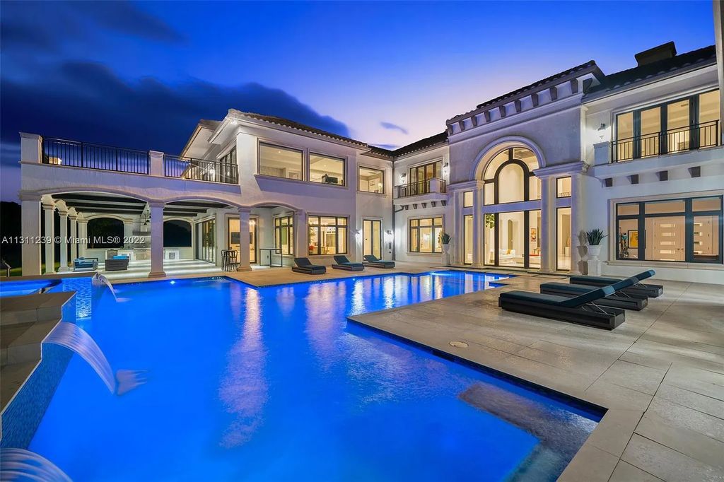 5875 Stone Creek Way, Fort Lauderdale, Florida, built by acclaimed builder Rick Bell, sits on 5 acres and boasts over 20,000 square feet of space. This incredible and one-of-a-kind custom compound's grand estate, including private gates, features volume ceilings, a resort-style pool, and top-of-the-line appliances.