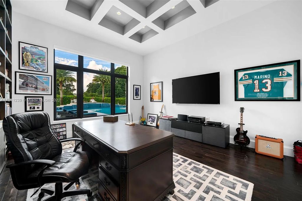 5875 Stone Creek Way, Fort Lauderdale, Florida, built by acclaimed builder Rick Bell, sits on 5 acres and boasts over 20,000 square feet of space. This incredible and one-of-a-kind custom compound's grand estate, including private gates, features volume ceilings, a resort-style pool, and top-of-the-line appliances.