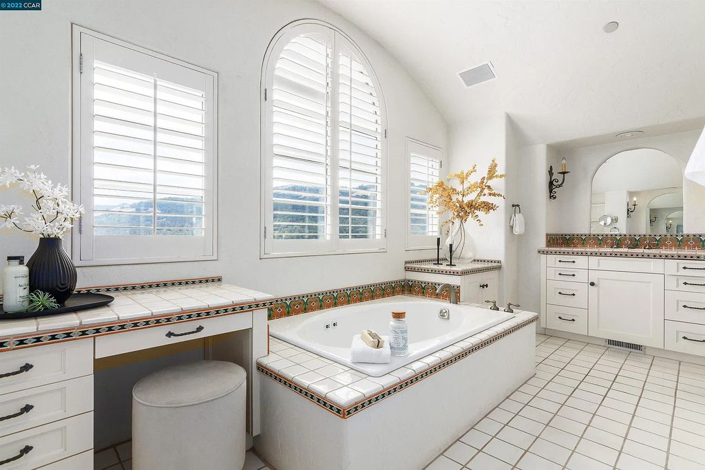 160 Camino Don Miguel, Orinda, California is a Spanish Revival estate originally constructed in 1929 sited on private gated grounds with breathtaking panoramic views, Mediterranean landscaping, offer a resort-like setting with direct access to the Orinda Country Club golf course.