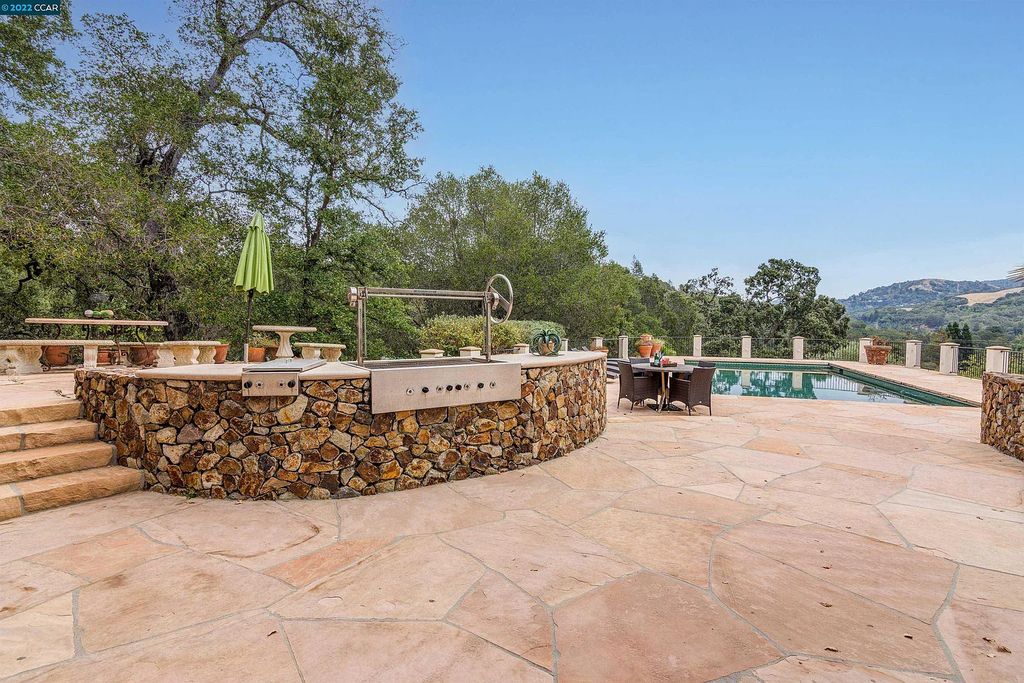 160 Camino Don Miguel, Orinda, California is a Spanish Revival estate originally constructed in 1929 sited on private gated grounds with breathtaking panoramic views, Mediterranean landscaping, offer a resort-like setting with direct access to the Orinda Country Club golf course.