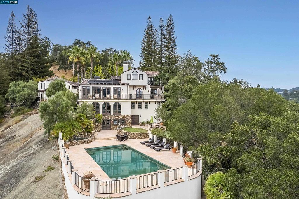 160 Camino Don Miguel, Orinda, California is a Spanish Revival estate originally constructed in 1929 sited on private gated grounds with breathtaking panoramic views, Mediterranean landscaping, offer a resort-like setting with direct access to the Orinda Country Club golf course.