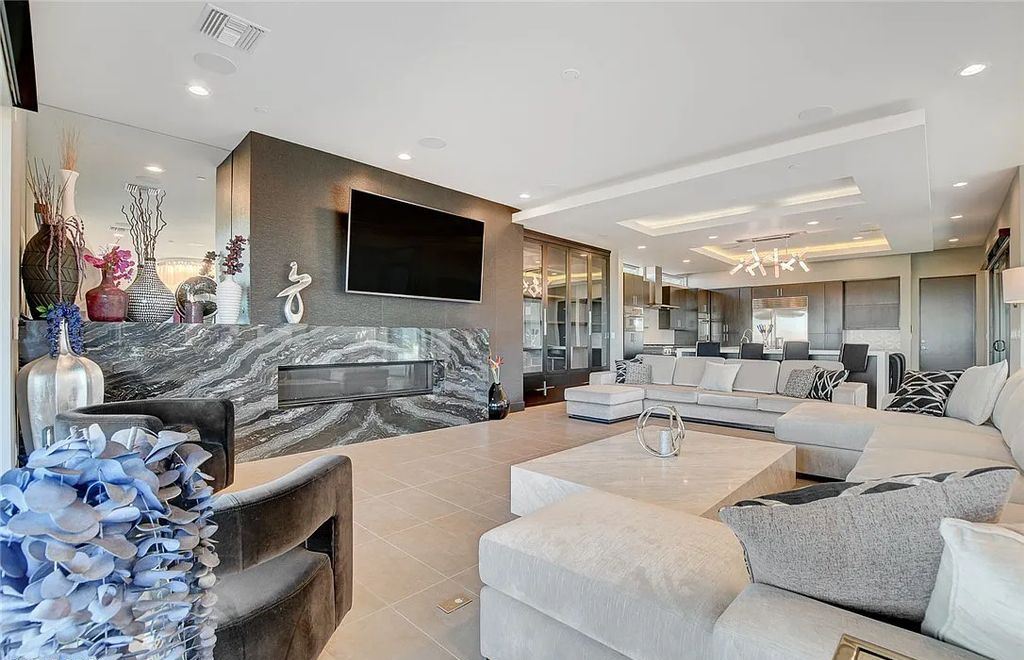 11296 Villa Bellagio Drive, Las Vegas, Nevada is a stunning modern home situated on an elevated lot within the highly sought after Bluffs at Tuscan Cliffs Southern Highlands guard gated community with breathtaking city, mountain and strip views.