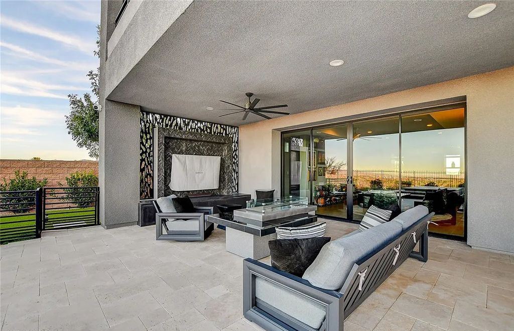 11296 Villa Bellagio Drive, Las Vegas, Nevada is a stunning modern home situated on an elevated lot within the highly sought after Bluffs at Tuscan Cliffs Southern Highlands guard gated community with breathtaking city, mountain and strip views.