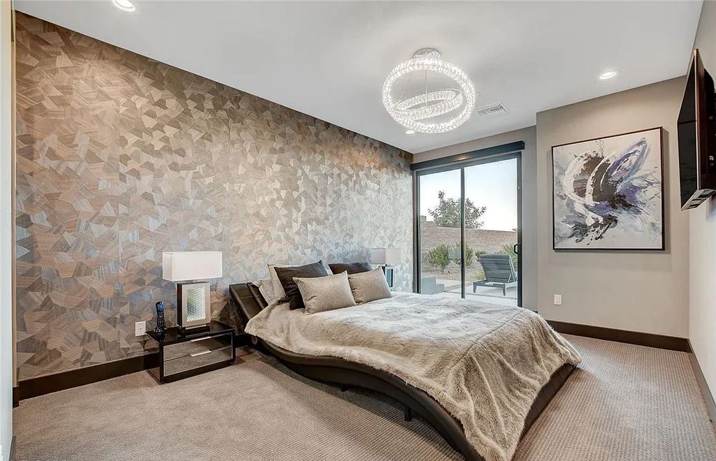 11296 Villa Bellagio Drive, Las Vegas, Nevada is a stunning modern home situated on an elevated lot within the highly sought after Bluffs at Tuscan Cliffs Southern Highlands guard gated community with breathtaking city, mountain and strip views.