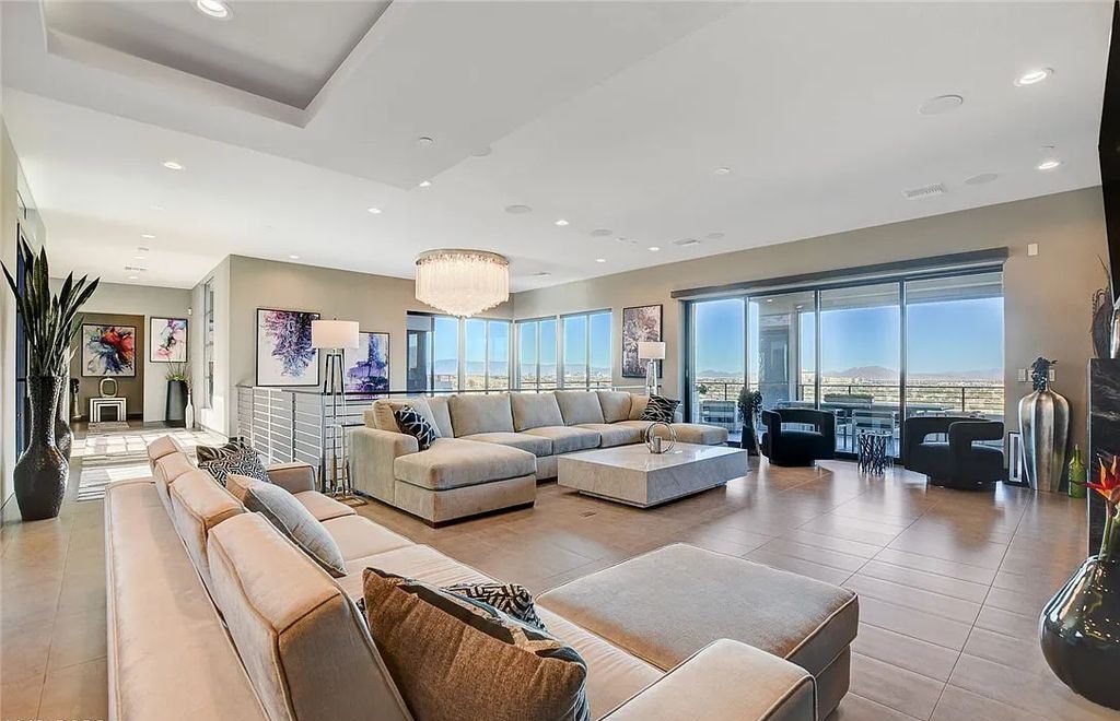 11296 Villa Bellagio Drive, Las Vegas, Nevada is a stunning modern home situated on an elevated lot within the highly sought after Bluffs at Tuscan Cliffs Southern Highlands guard gated community with breathtaking city, mountain and strip views.