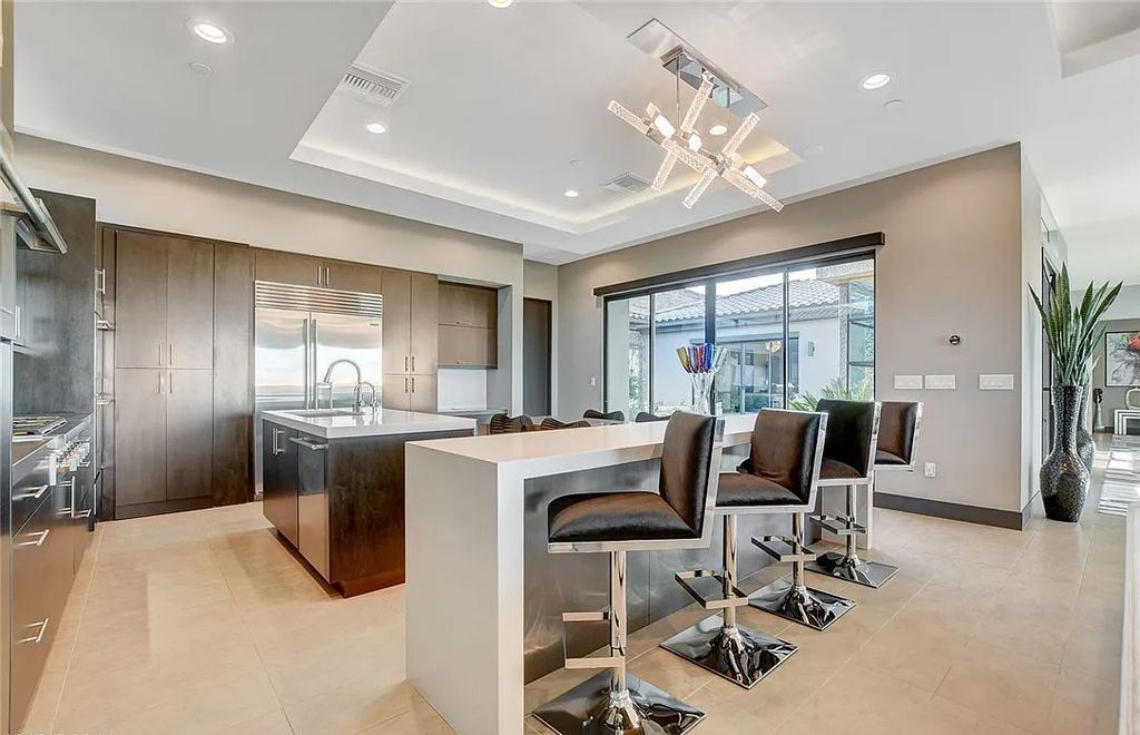 11296 Villa Bellagio Drive, Las Vegas, Nevada is a stunning modern home situated on an elevated lot within the highly sought after Bluffs at Tuscan Cliffs Southern Highlands guard gated community with breathtaking city, mountain and strip views.