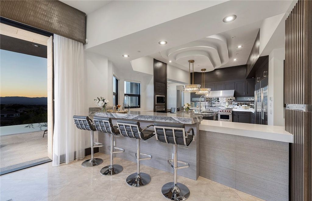 15 Yorkridge Court, Henderson, Nevada is a modern custom in guard gated Anthem Country Club remodeled in 2022 with open indoor outdoor concept, dramatic architecture, gorgeous finishes. 