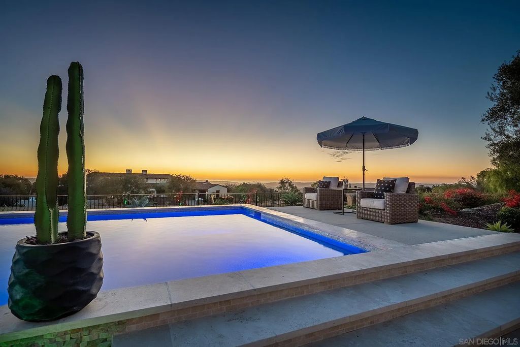 8069 Entrada De Luz East, San Diego, California is an exquisite estate located on in one of the most exclusive, gated golf communities in San Diego, boasts total privacy, large living areas, open through disappearing doors to multiple covered patios.