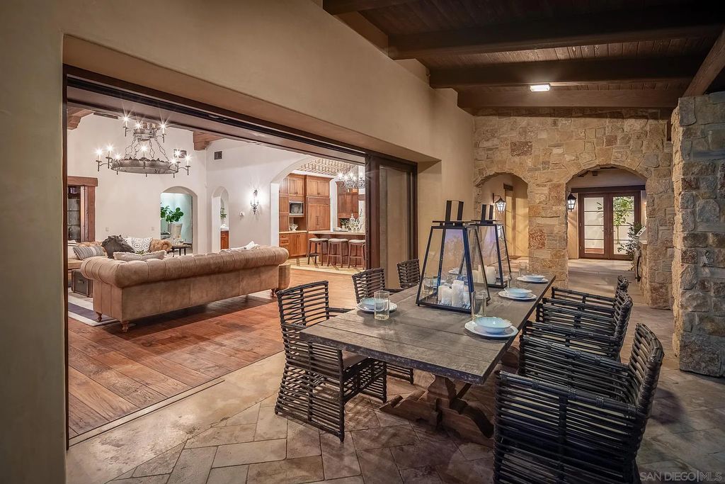 8069 Entrada De Luz East, San Diego, California is an exquisite estate located on in one of the most exclusive, gated golf communities in San Diego, boasts total privacy, large living areas, open through disappearing doors to multiple covered patios.