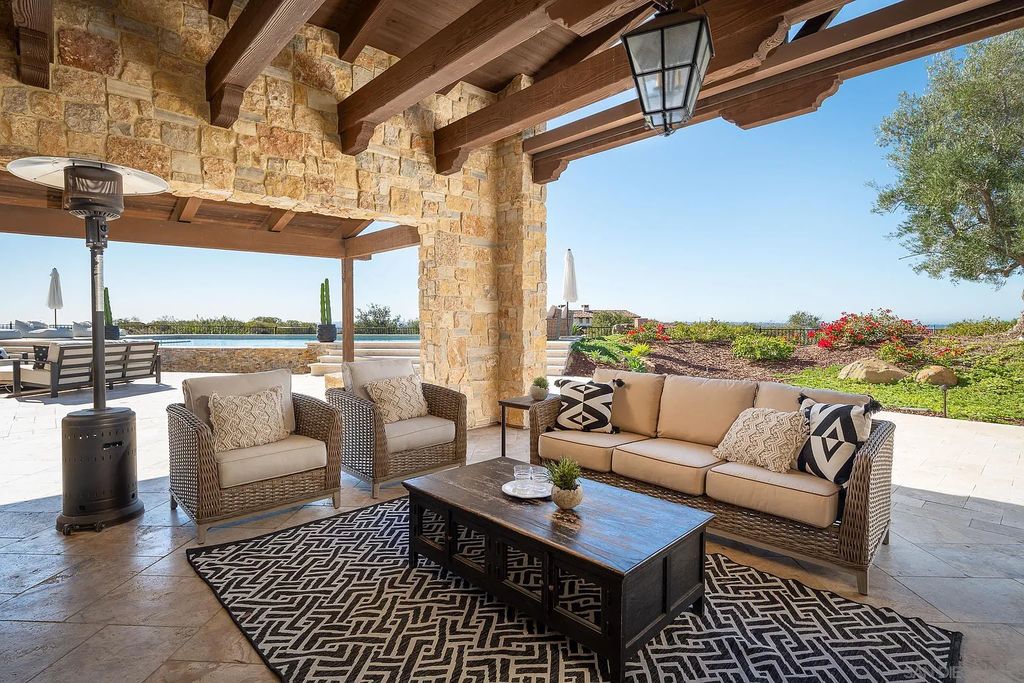 8069 Entrada De Luz East, San Diego, California is an exquisite estate located on in one of the most exclusive, gated golf communities in San Diego, boasts total privacy, large living areas, open through disappearing doors to multiple covered patios.