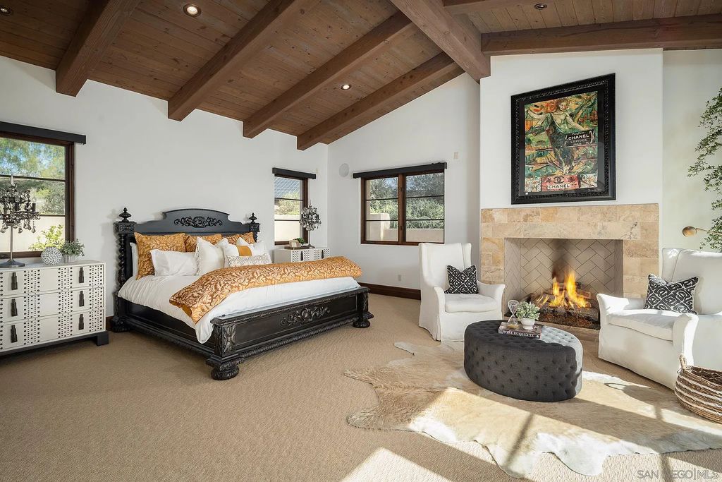8069 Entrada De Luz East, San Diego, California is an exquisite estate located on in one of the most exclusive, gated golf communities in San Diego, boasts total privacy, large living areas, open through disappearing doors to multiple covered patios.