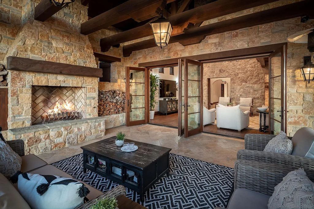 8069 Entrada De Luz East, San Diego, California is an exquisite estate located on in one of the most exclusive, gated golf communities in San Diego, boasts total privacy, large living areas, open through disappearing doors to multiple covered patios.