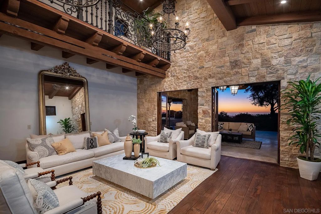 8069 Entrada De Luz East, San Diego, California is an exquisite estate located on in one of the most exclusive, gated golf communities in San Diego, boasts total privacy, large living areas, open through disappearing doors to multiple covered patios.