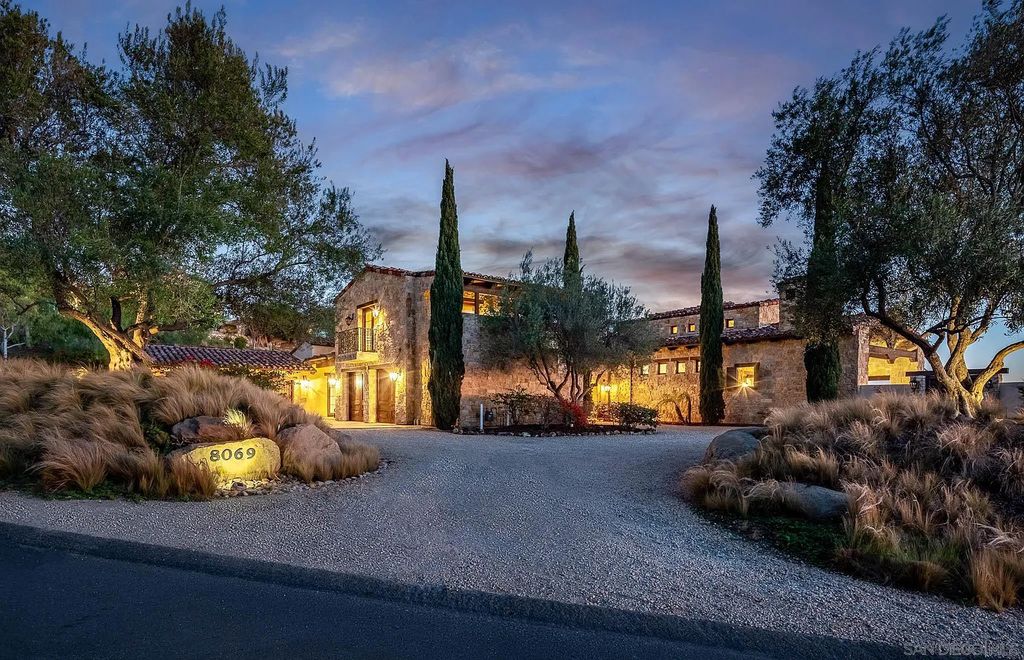 8069 Entrada De Luz East, San Diego, California is an exquisite estate located on in one of the most exclusive, gated golf communities in San Diego, boasts total privacy, large living areas, open through disappearing doors to multiple covered patios.