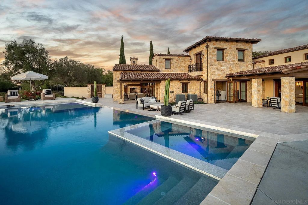 8069 Entrada De Luz East, San Diego, California is an exquisite estate located on in one of the most exclusive, gated golf communities in San Diego, boasts total privacy, large living areas, open through disappearing doors to multiple covered patios.