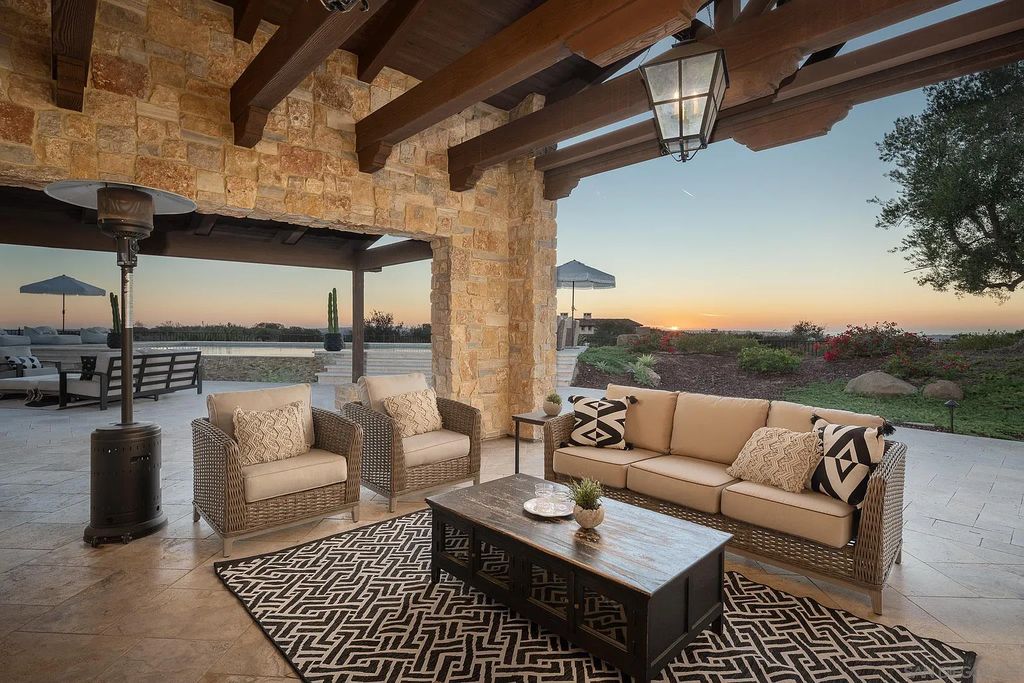 8069 Entrada De Luz East, San Diego, California is an exquisite estate located on in one of the most exclusive, gated golf communities in San Diego, boasts total privacy, large living areas, open through disappearing doors to multiple covered patios.