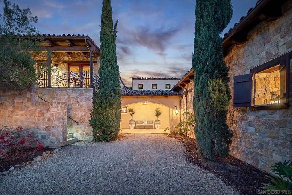 8069 Entrada De Luz East, San Diego, California is an exquisite estate located on in one of the most exclusive, gated golf communities in San Diego, boasts total privacy, large living areas, open through disappearing doors to multiple covered patios.