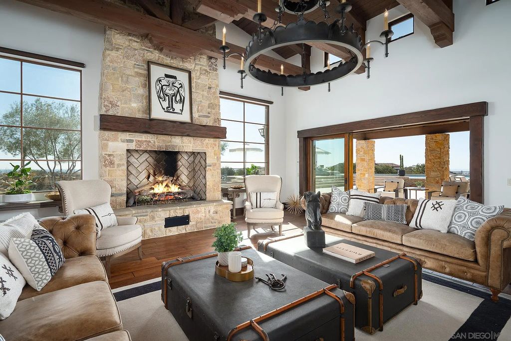 8069 Entrada De Luz East, San Diego, California is an exquisite estate located on in one of the most exclusive, gated golf communities in San Diego, boasts total privacy, large living areas, open through disappearing doors to multiple covered patios.