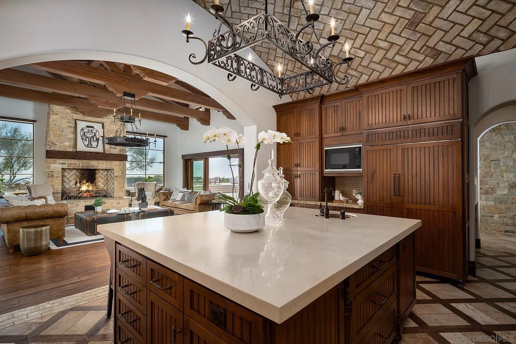 8069 Entrada De Luz East, San Diego, California is an exquisite estate located on in one of the most exclusive, gated golf communities in San Diego, boasts total privacy, large living areas, open through disappearing doors to multiple covered patios.