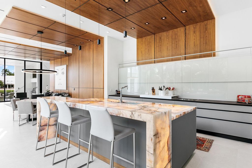 160 Spyglass Lane, Jupiter, Florida, stands out among the elegance of Jupiter’s coveted Admiral’s Cove, with intricate stone and wood finishes. A summer kitchen and 100 feet of pristine beach on the outside, with views of the Intracoastal Waterway, make this a truly delightful location.
