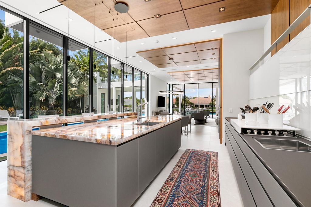 160 Spyglass Lane, Jupiter, Florida, stands out among the elegance of Jupiter’s coveted Admiral’s Cove, with intricate stone and wood finishes. A summer kitchen and 100 feet of pristine beach on the outside, with views of the Intracoastal Waterway, make this a truly delightful location.