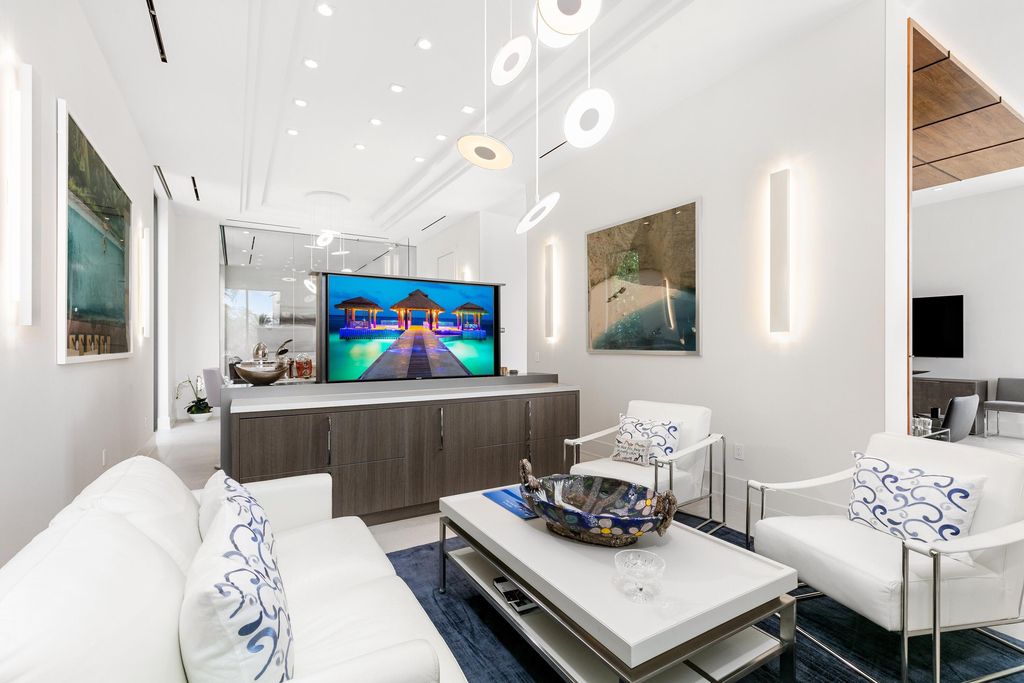 160 Spyglass Lane, Jupiter, Florida, stands out among the elegance of Jupiter’s coveted Admiral’s Cove, with intricate stone and wood finishes. A summer kitchen and 100 feet of pristine beach on the outside, with views of the Intracoastal Waterway, make this a truly delightful location.