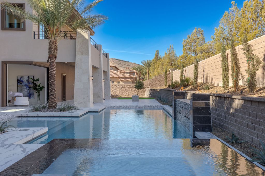 38 Ravenswood Avenue, Las Vegas, Nevada is a new custom home in the 24-hour guard-gated community of Southern Highlands Golf Club and breathtaking views of the nearby mountains.