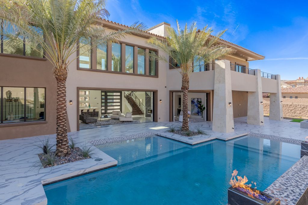 38 Ravenswood Avenue, Las Vegas, Nevada is a new custom home in the 24-hour guard-gated community of Southern Highlands Golf Club and breathtaking views of the nearby mountains.