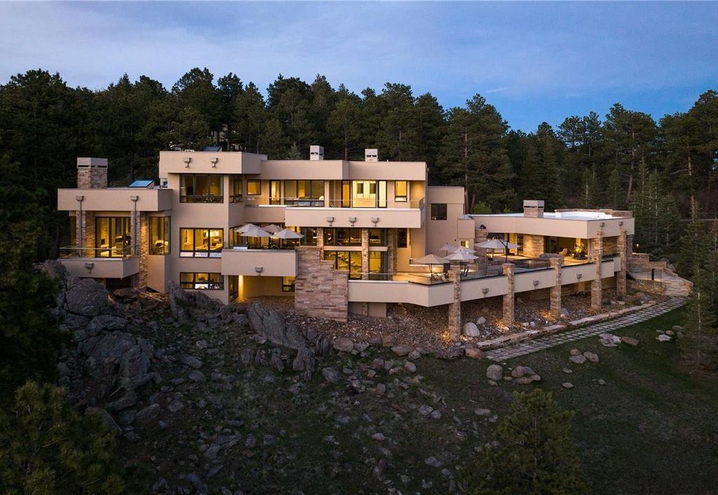 1733 Montane Drive East, Golden, Colorado is a modern mountain estate perched on top of a Genesee peak were designed to accentuate the cascading Rocky Mountain views from nearly every window.