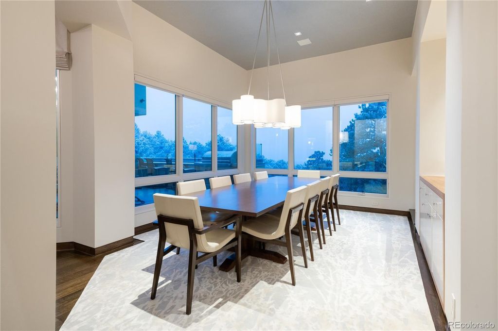1733 Montane Drive East, Golden, Colorado is a modern mountain estate perched on top of a Genesee peak were designed to accentuate the cascading Rocky Mountain views from nearly every window.