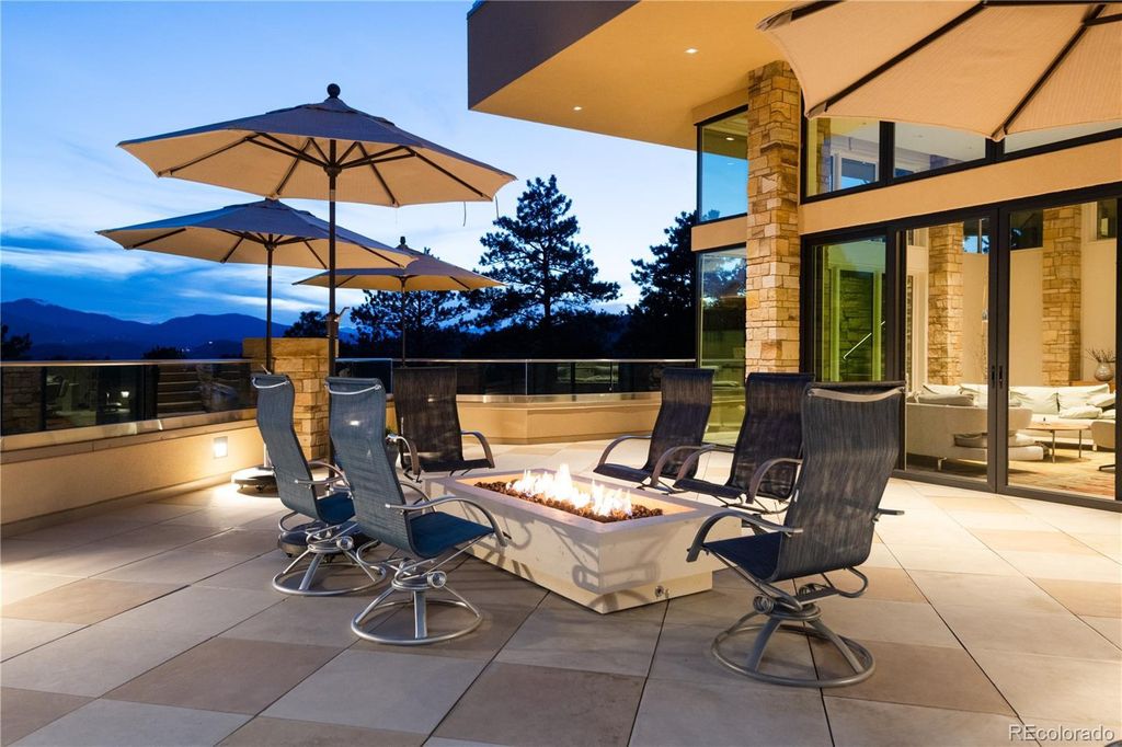 1733 Montane Drive East, Golden, Colorado is a modern mountain estate perched on top of a Genesee peak were designed to accentuate the cascading Rocky Mountain views from nearly every window.