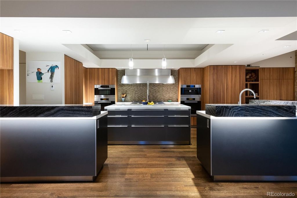1733 Montane Drive East, Golden, Colorado is a modern mountain estate perched on top of a Genesee peak were designed to accentuate the cascading Rocky Mountain views from nearly every window.