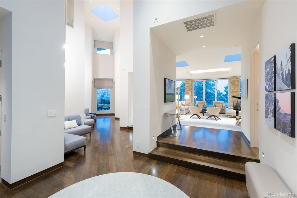 1733 Montane Drive East, Golden, Colorado is a modern mountain estate perched on top of a Genesee peak were designed to accentuate the cascading Rocky Mountain views from nearly every window.