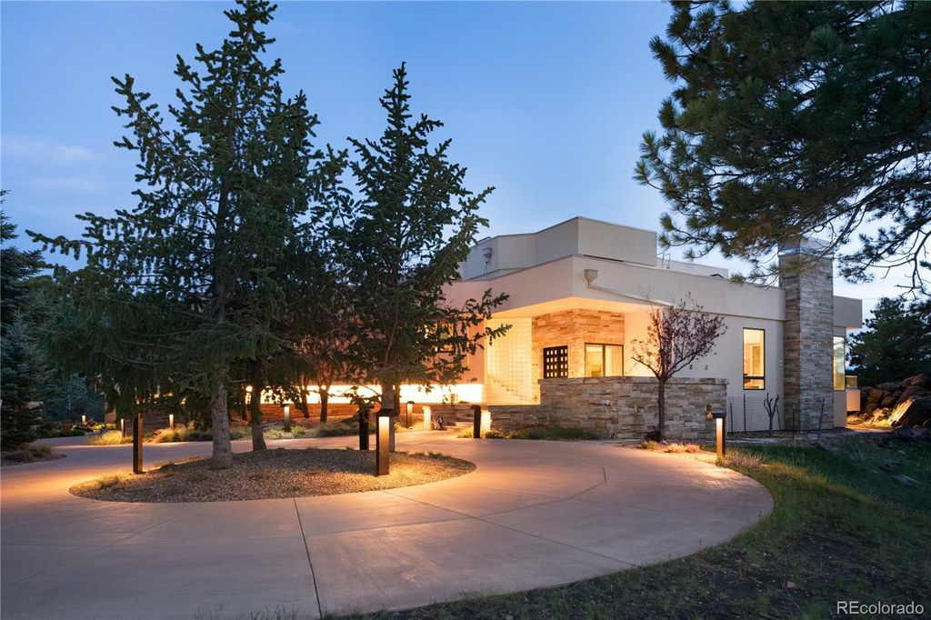 1733 Montane Drive East, Golden, Colorado is a modern mountain estate perched on top of a Genesee peak were designed to accentuate the cascading Rocky Mountain views from nearly every window.