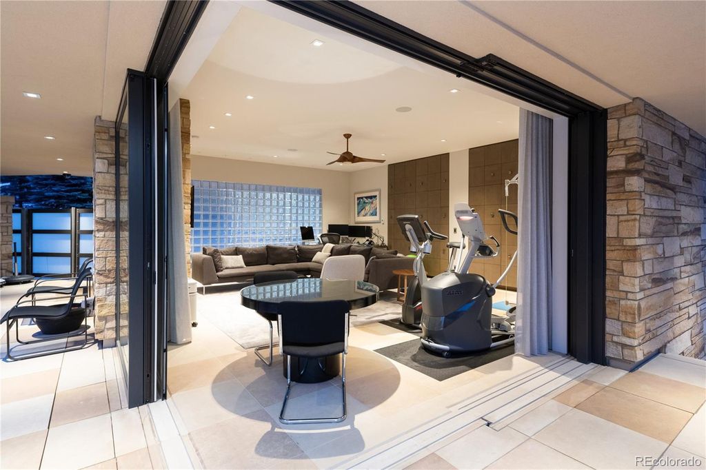 1733 Montane Drive East, Golden, Colorado is a modern mountain estate perched on top of a Genesee peak were designed to accentuate the cascading Rocky Mountain views from nearly every window.