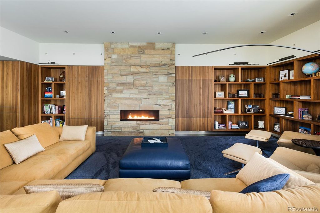 1733 Montane Drive East, Golden, Colorado is a modern mountain estate perched on top of a Genesee peak were designed to accentuate the cascading Rocky Mountain views from nearly every window.