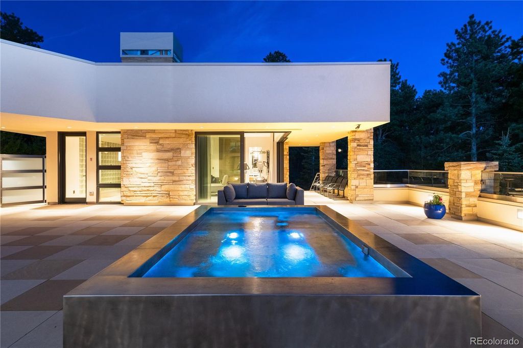 1733 Montane Drive East, Golden, Colorado is a modern mountain estate perched on top of a Genesee peak were designed to accentuate the cascading Rocky Mountain views from nearly every window.