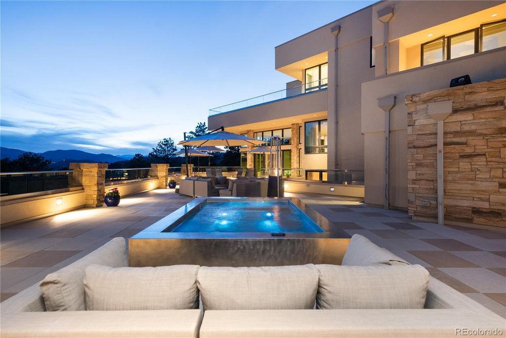 1733 Montane Drive East, Golden, Colorado is a modern mountain estate perched on top of a Genesee peak were designed to accentuate the cascading Rocky Mountain views from nearly every window.