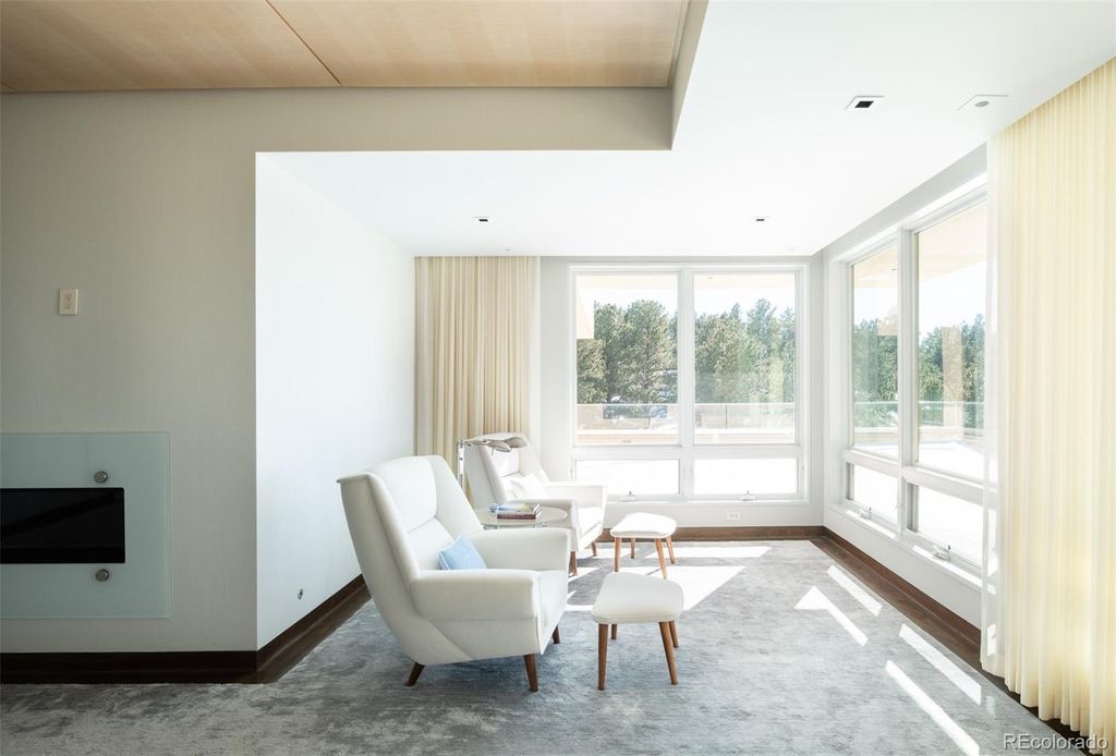 1733 Montane Drive East, Golden, Colorado is a modern mountain estate perched on top of a Genesee peak were designed to accentuate the cascading Rocky Mountain views from nearly every window.