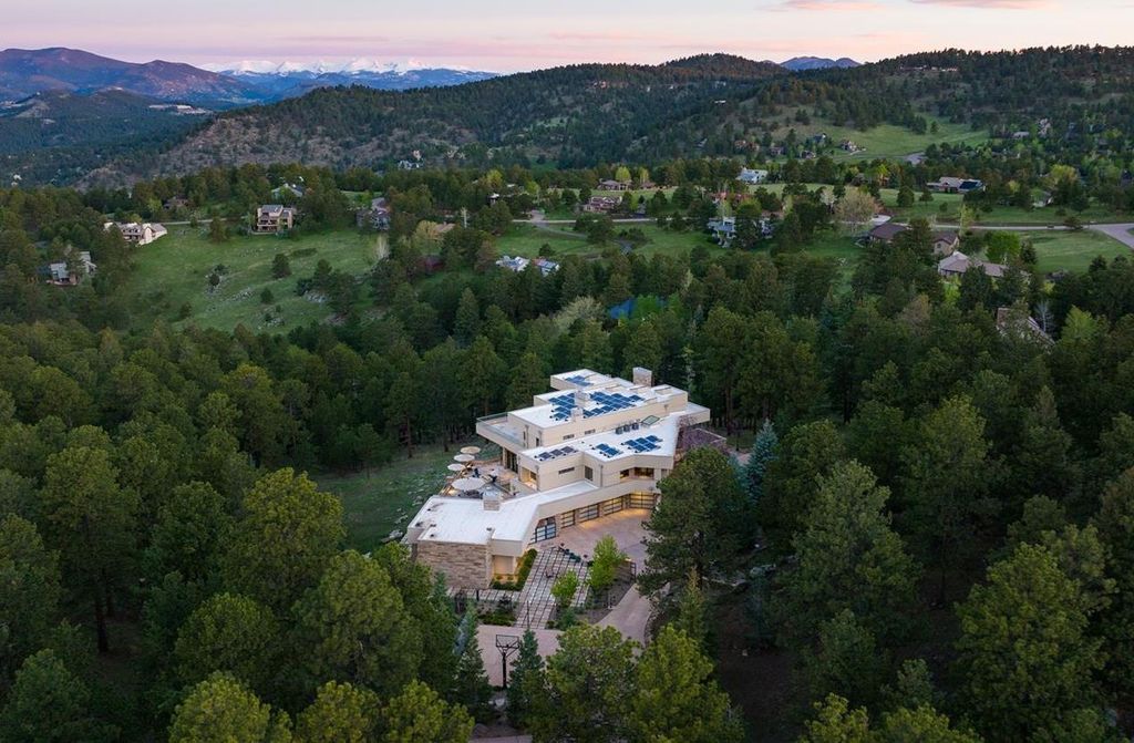 1733 Montane Drive East, Golden, Colorado is a modern mountain estate perched on top of a Genesee peak were designed to accentuate the cascading Rocky Mountain views from nearly every window.