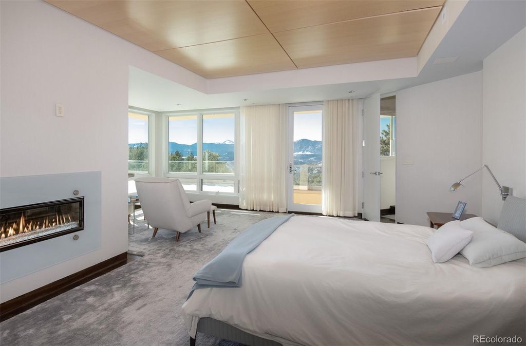 1733 Montane Drive East, Golden, Colorado is a modern mountain estate perched on top of a Genesee peak were designed to accentuate the cascading Rocky Mountain views from nearly every window.