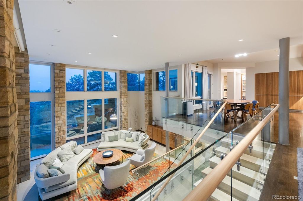 1733 Montane Drive East, Golden, Colorado is a modern mountain estate perched on top of a Genesee peak were designed to accentuate the cascading Rocky Mountain views from nearly every window.