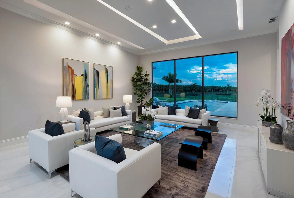 17055 Brulee Breeze Way, Boca Raton, Florida, is located in the heart of Boca Raton, Boca Bridges' centralized location, on an oversized 0.72 +- acre lot, which is the largest model offered at Boca Bridges. Integrating the sophisticated grandeur of resort-style living with family friendly amenities, this home offers a wide array of world-class amenities.