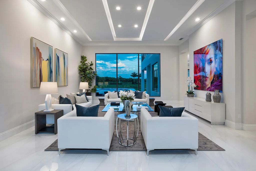 17055 Brulee Breeze Way, Boca Raton, Florida, is located in the heart of Boca Raton, Boca Bridges' centralized location, on an oversized 0.72 +- acre lot, which is the largest model offered at Boca Bridges. Integrating the sophisticated grandeur of resort-style living with family friendly amenities, this home offers a wide array of world-class amenities.
