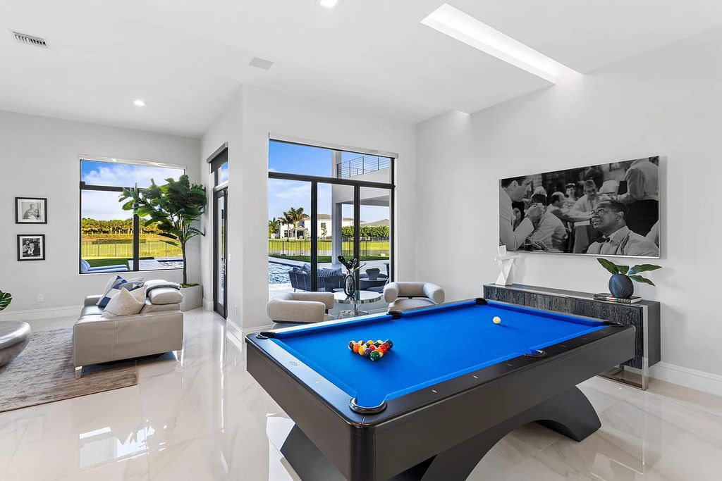 17055 Brulee Breeze Way, Boca Raton, Florida, is located in the heart of Boca Raton, Boca Bridges' centralized location, on an oversized 0.72 +- acre lot, which is the largest model offered at Boca Bridges. Integrating the sophisticated grandeur of resort-style living with family friendly amenities, this home offers a wide array of world-class amenities.