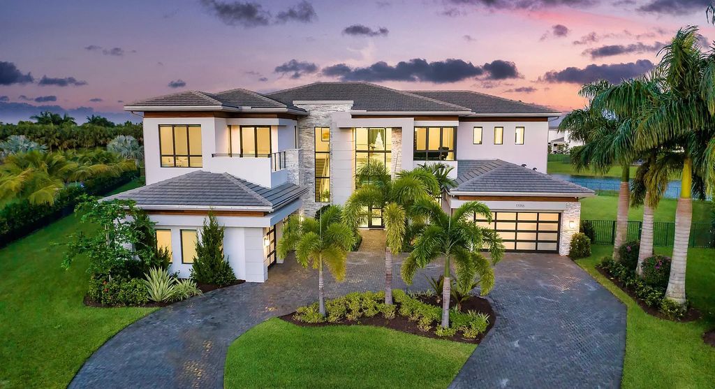 17055 Brulee Breeze Way, Boca Raton, Florida, is located in the heart of Boca Raton, Boca Bridges' centralized location, on an oversized 0.72 +- acre lot, which is the largest model offered at Boca Bridges. Integrating the sophisticated grandeur of resort-style living with family friendly amenities, this home offers a wide array of world-class amenities.