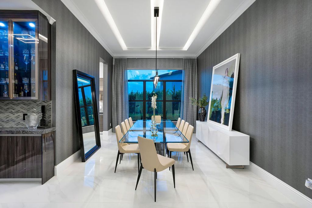 17055 Brulee Breeze Way, Boca Raton, Florida, is located in the heart of Boca Raton, Boca Bridges' centralized location, on an oversized 0.72 +- acre lot, which is the largest model offered at Boca Bridges. Integrating the sophisticated grandeur of resort-style living with family friendly amenities, this home offers a wide array of world-class amenities.